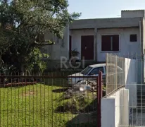 Casa com 4 Quartos à venda, 129m² no Santa Fé, Porto Alegre - Foto 9